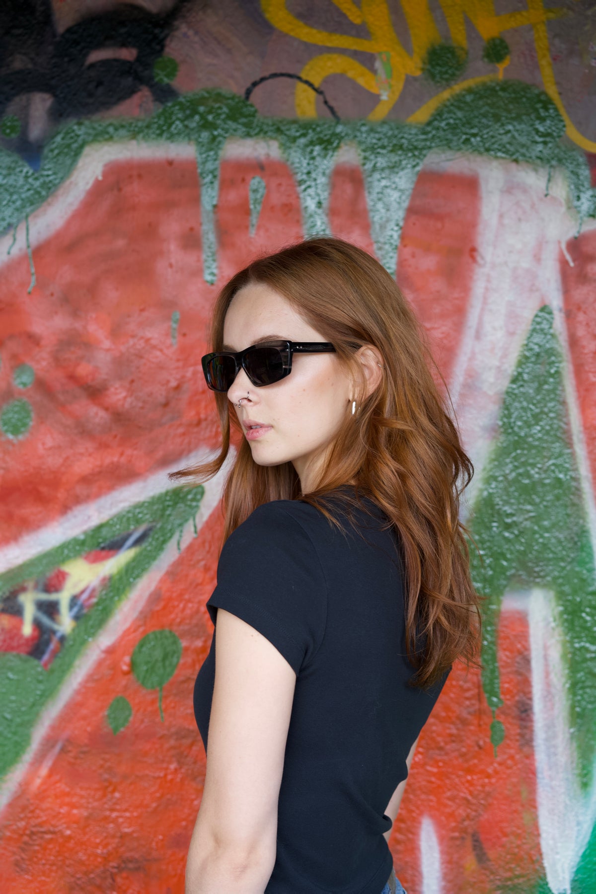 Model wearing SYNTH rave sunglasses by BACKSTAGE