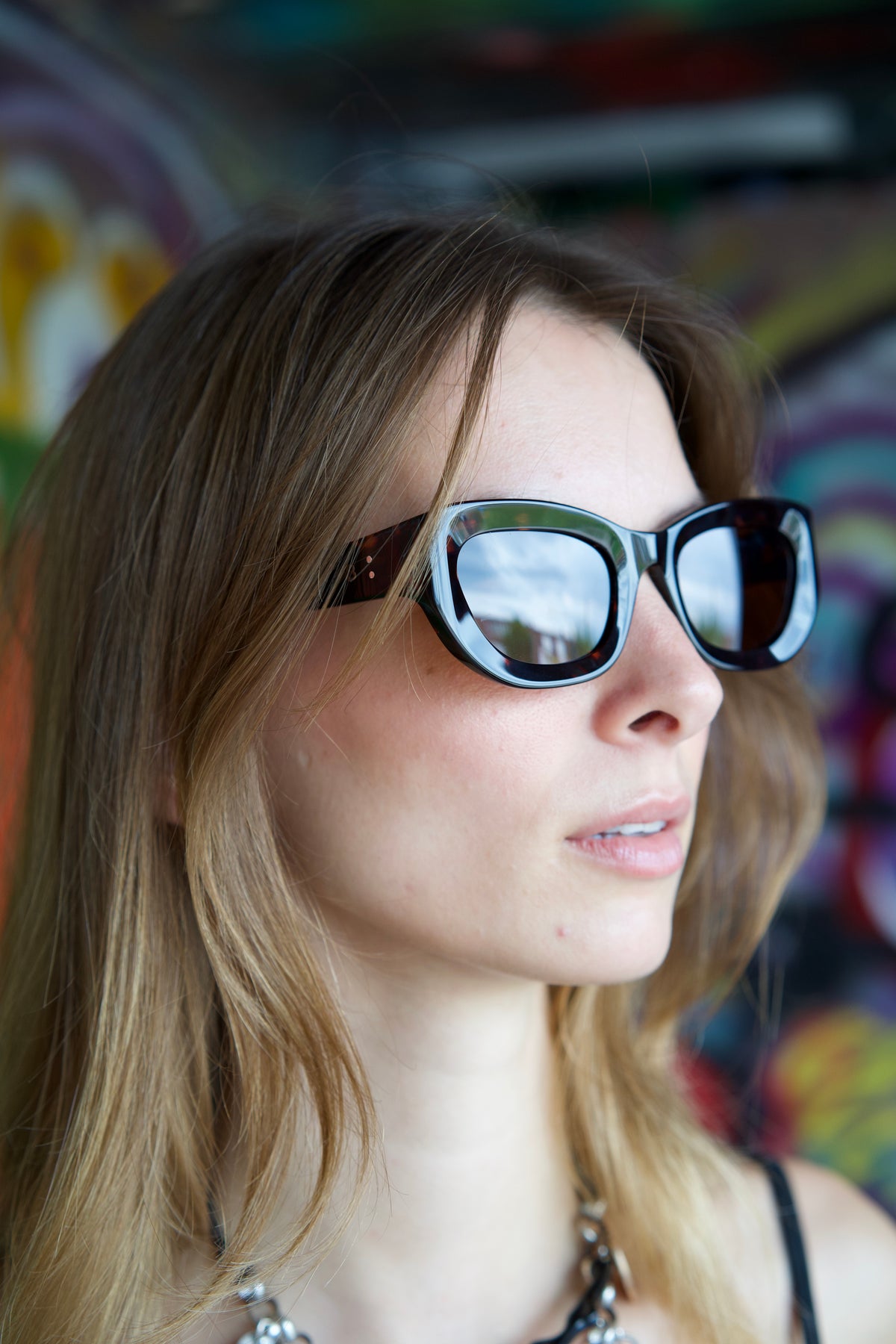 Model wearing VOCAL festival sunglasses by BACKSTAGE