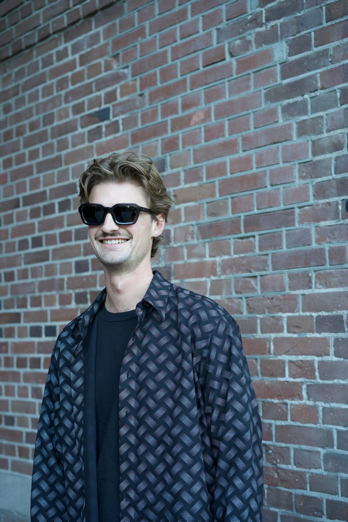 Model wearing KICK rave sunglasses by BACKSTAGE