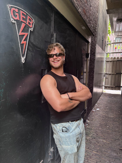Model wearing BASS black rectangular sunglasses by BACKSTAGE